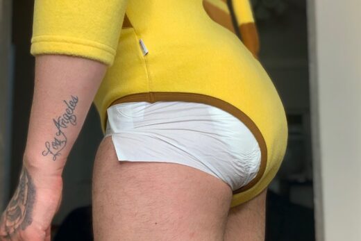 Adult baby in Pikachu onesie and a diaper