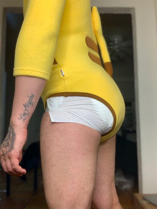 Adult baby in Pikachu onesie and a diaper